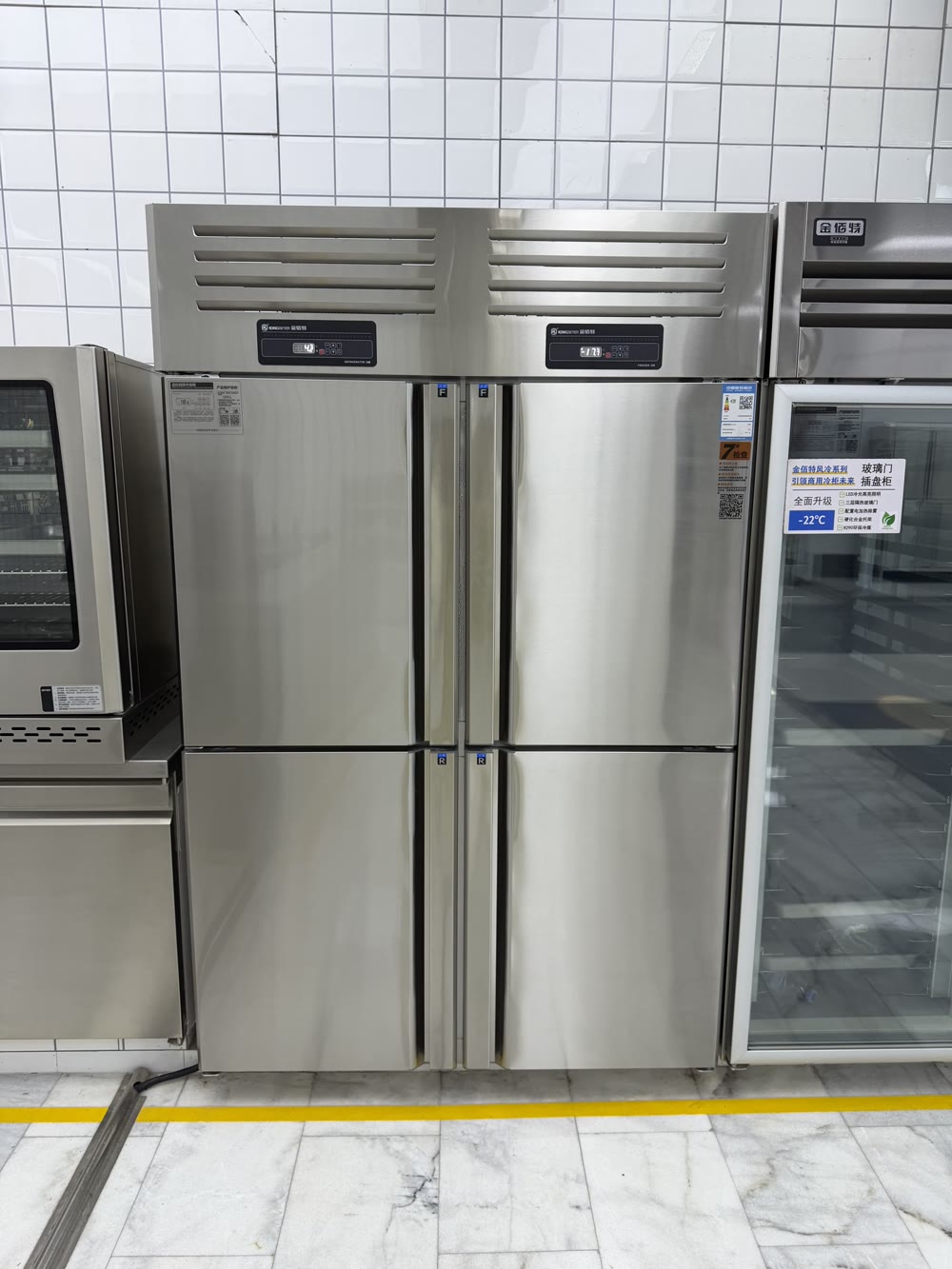 Four-door stainless steel reach-in commercial freezer, photographed on site