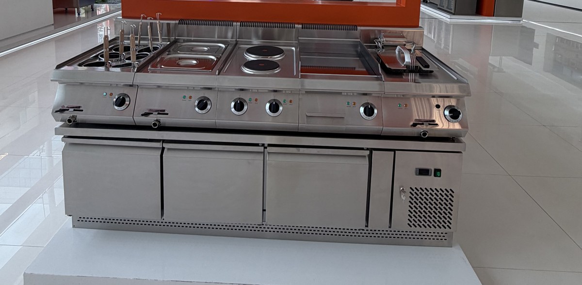 Western kitchen cooking range with electric hobs and refrigerated base